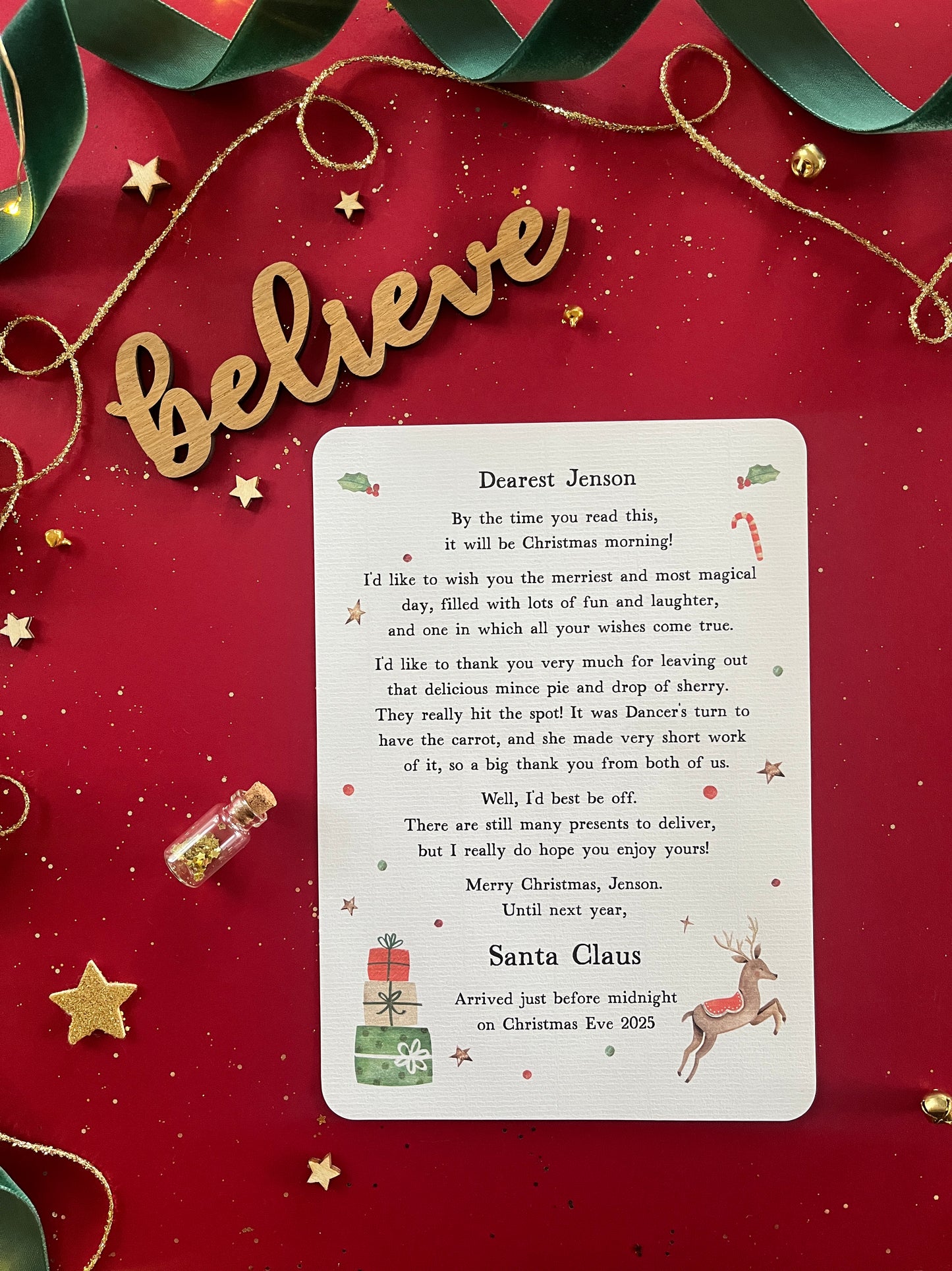 A Christmas morning letter which is entirely personalised with your child's names and unique to them. Filled with magical illustrations and details of your Christmas Eve treats for Father Christmas or Santa Claus.
The note that is printed onto textured paper is pictured on a red background with magical decorations.
